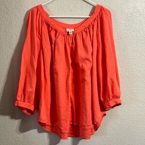 St John’s Bay V neck top color is coral (orange) it is not pink.